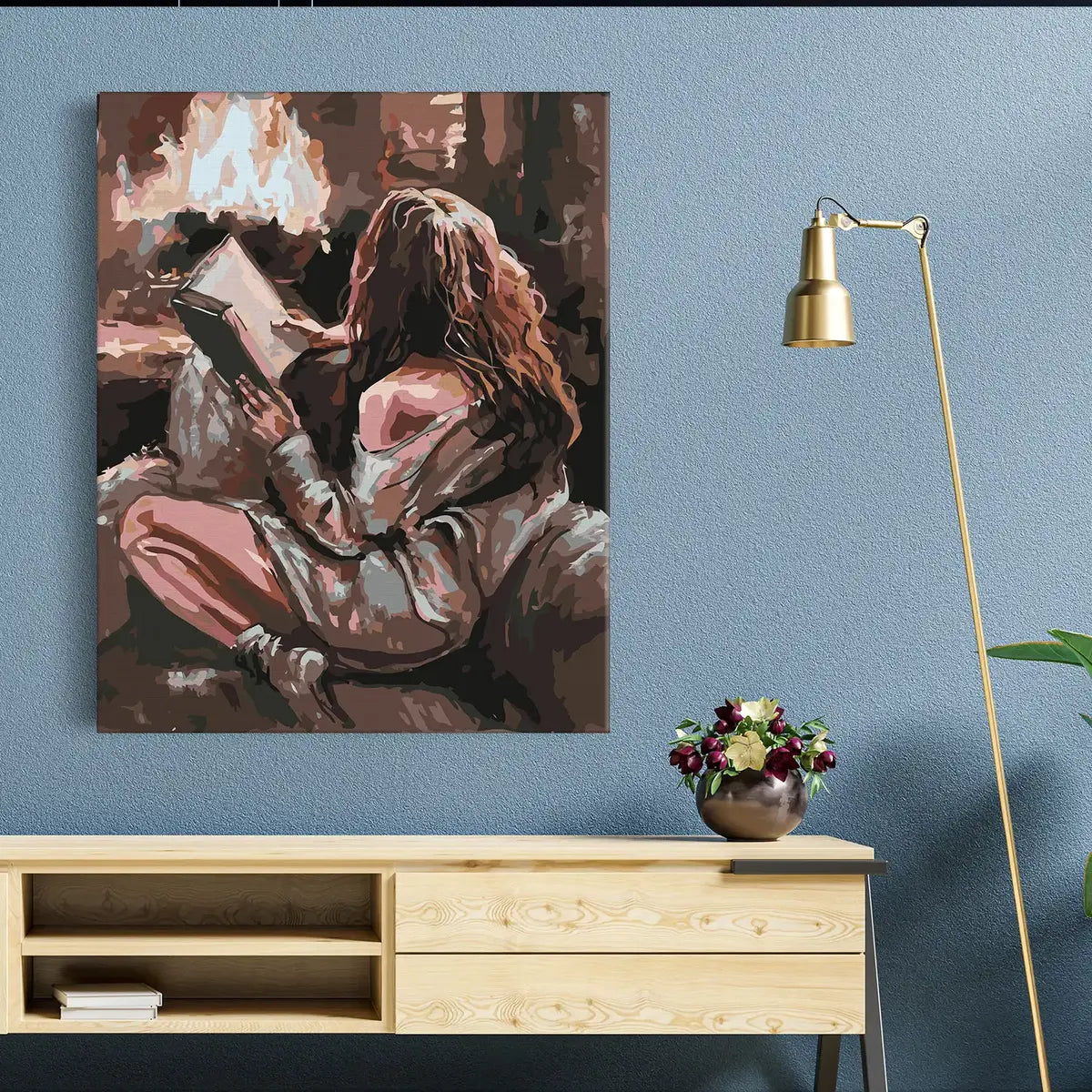 Dievča s knihou pri krbe